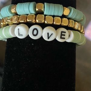 Bracelet set of three green and gold themed.